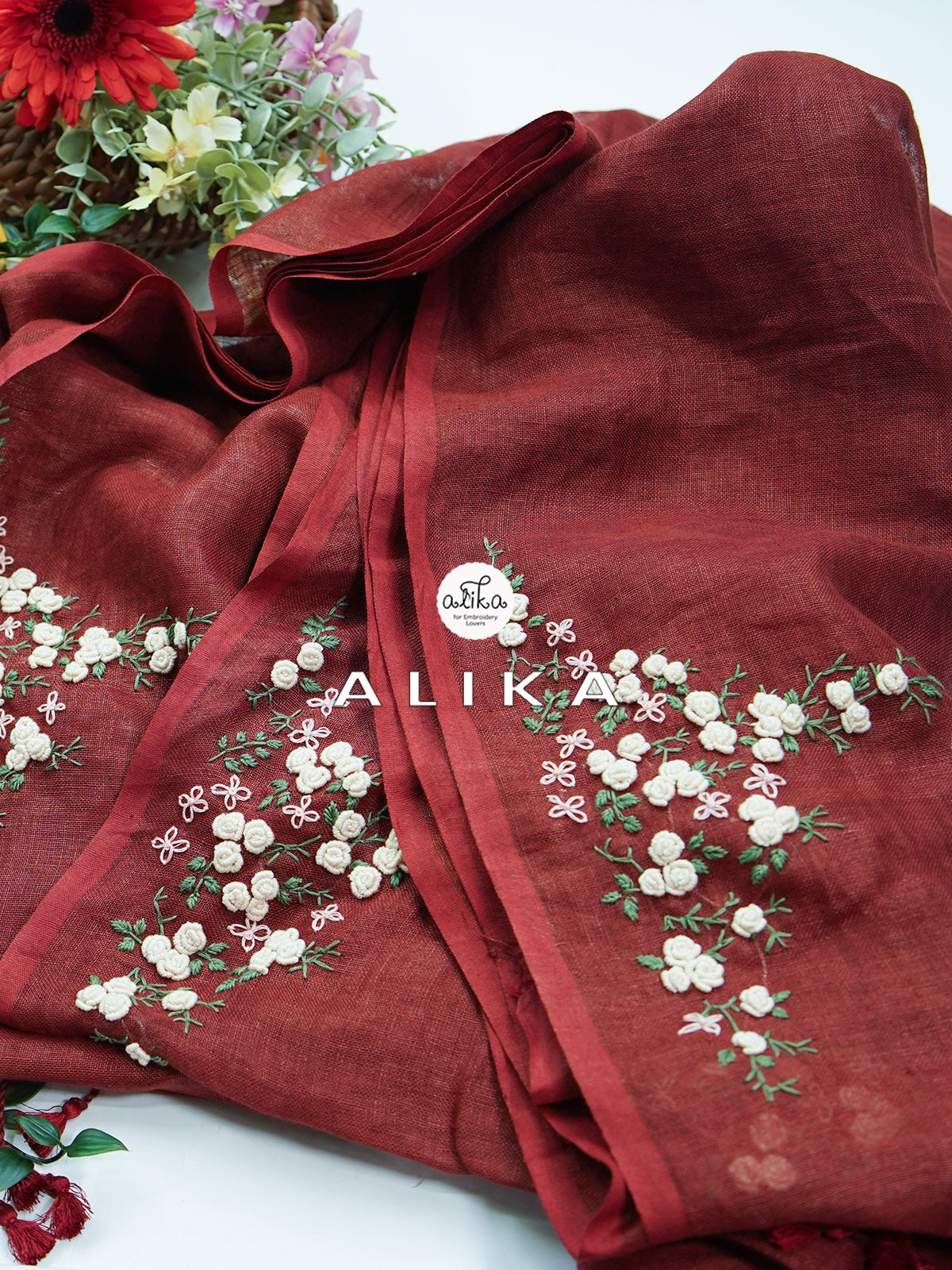 Regal Bloom: The Maroon Linen Saree with Exquisite Bullion Florals