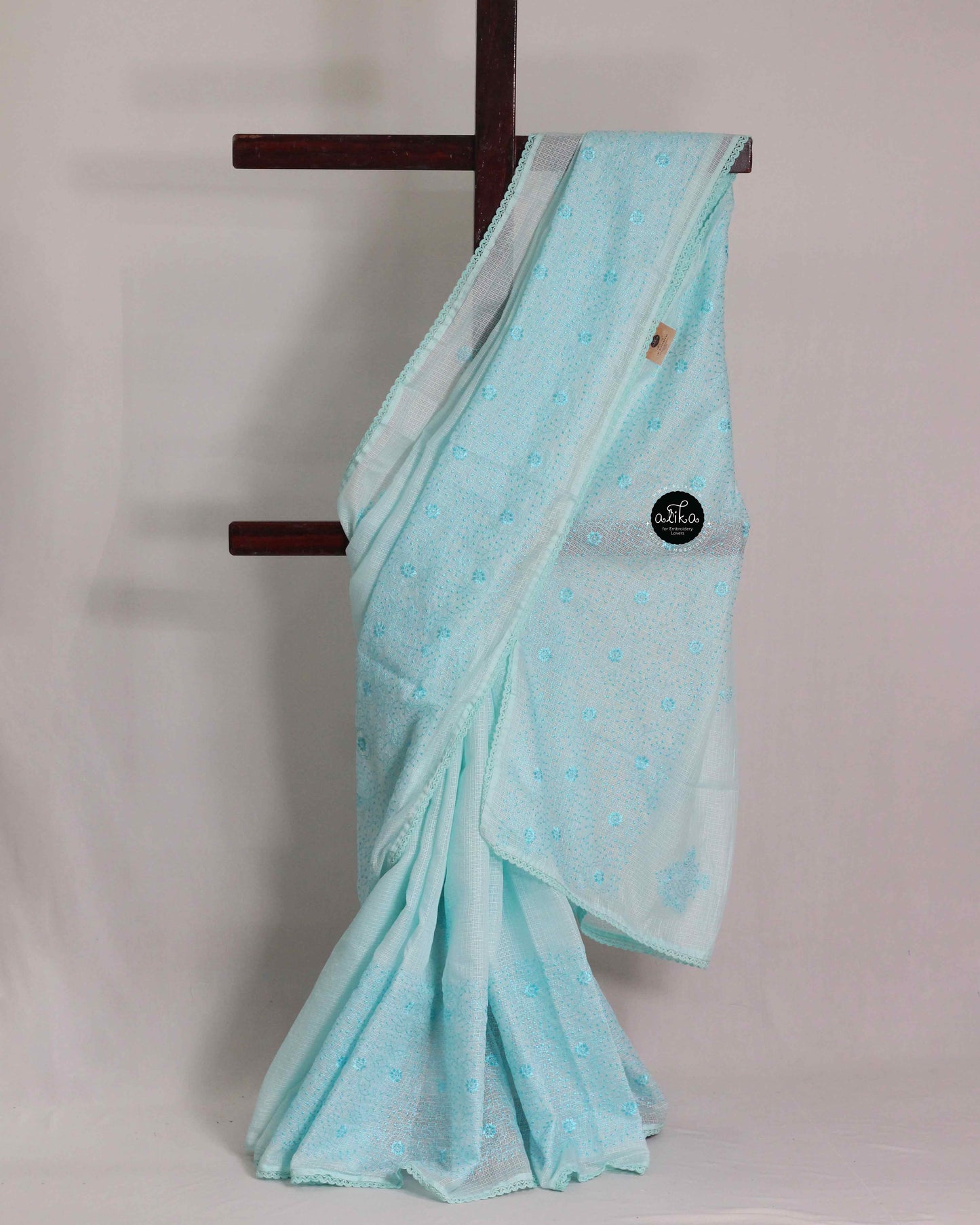Sky Blue silky Kota saree with floral machine embroidery and lace work