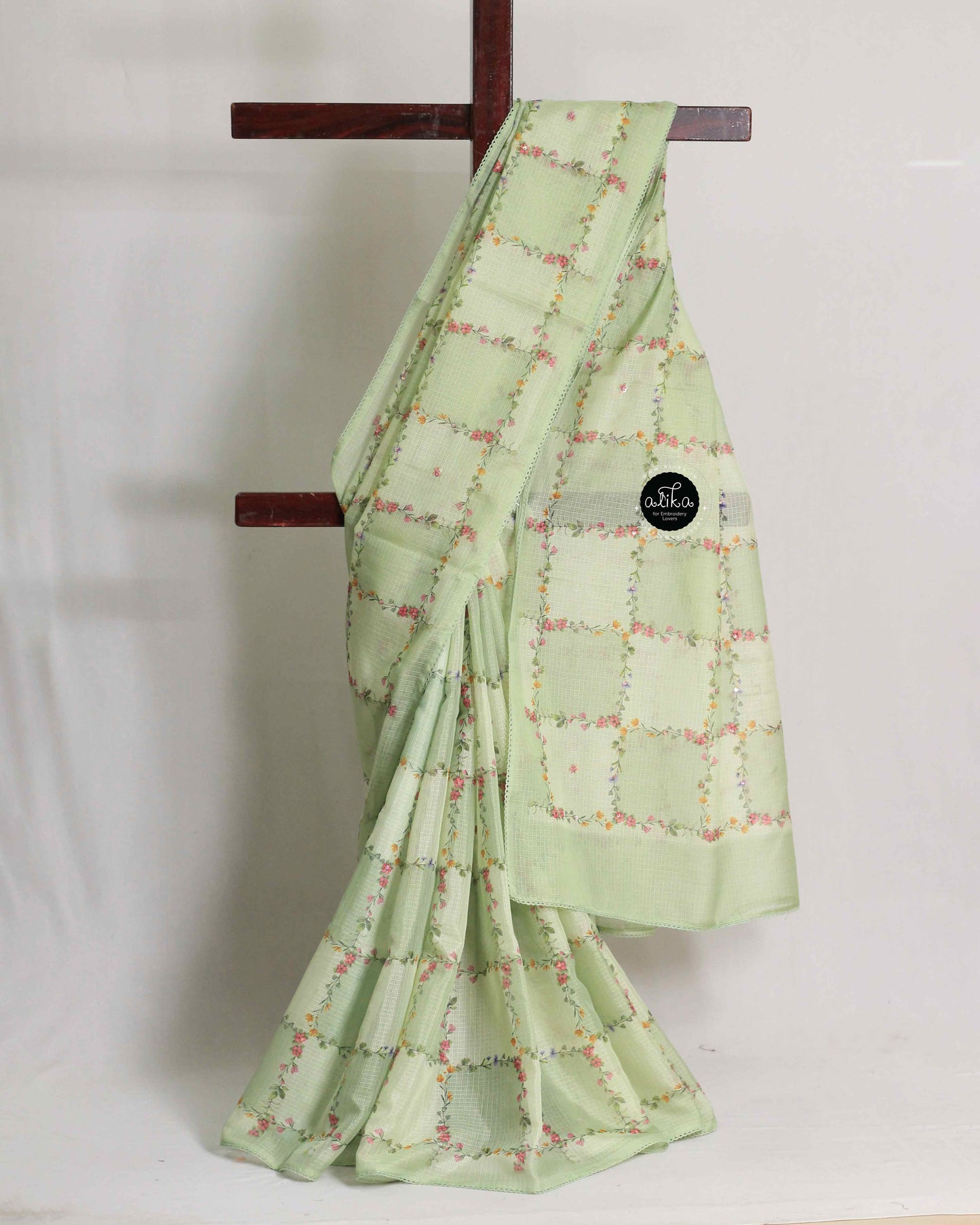 Light Green Silky Kota Saree with Floral Prints & Sequins | Alika Fashion Store