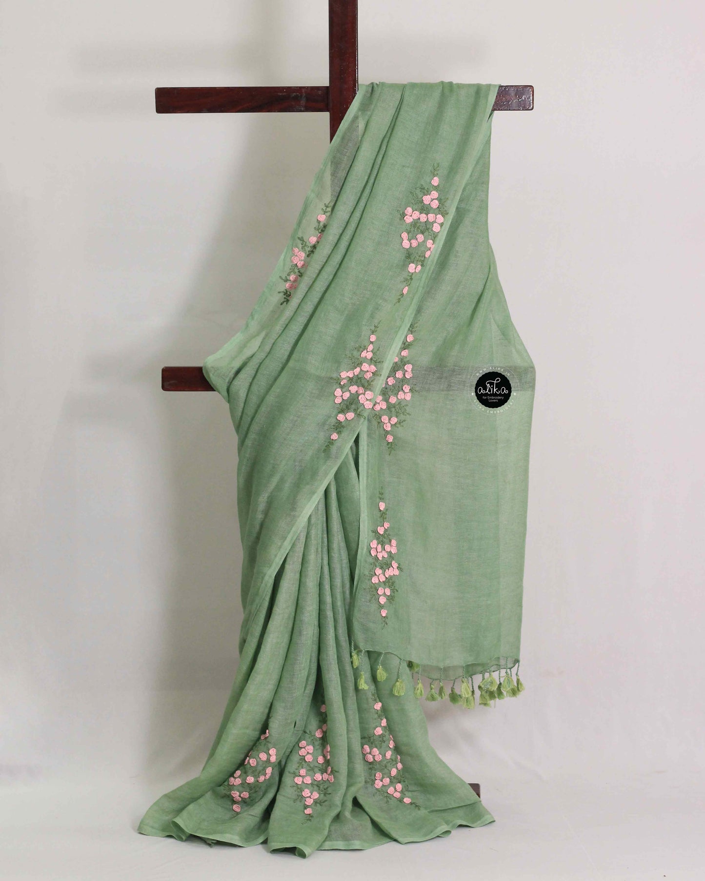 Mint green pure linen saree with floral hand embroidery