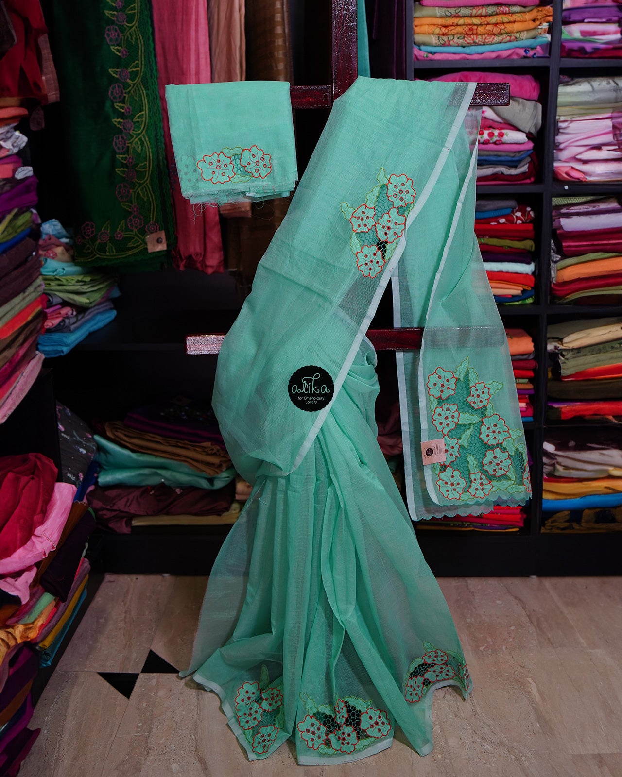 GREEN SILKY KOTA SAREE WITH TWINE WORK AND FLORAL EMBROIDERY