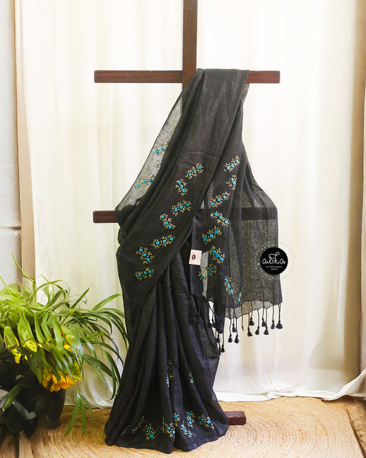 Graceful Black Linen Saree with Vibrant Blue Floral Work