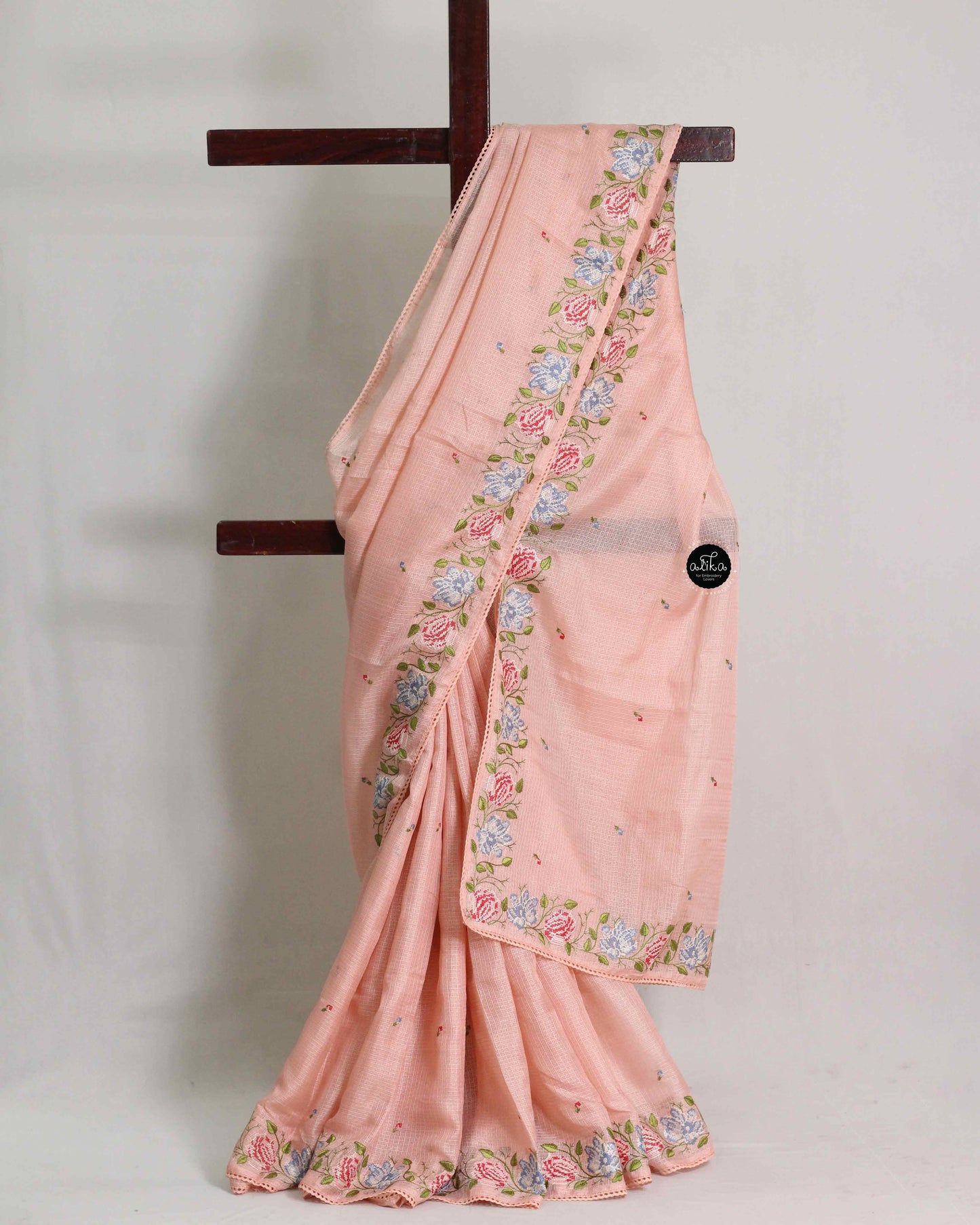 Light Orange Silky Kota Saree with Floral Machine Embroidery & Lace Piping