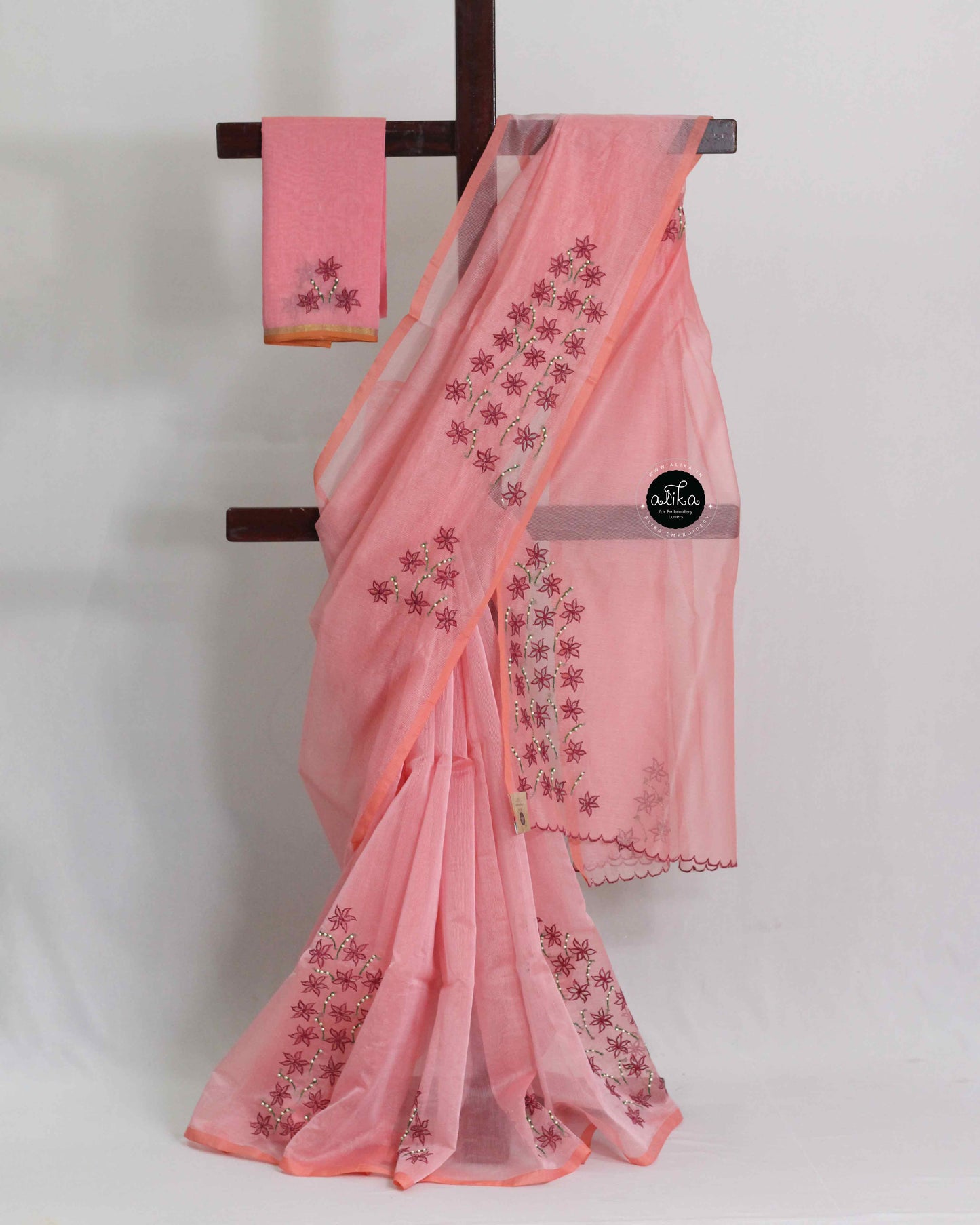 Blush Pink Kota Saree with Red Floral Cut Work and Pearl Embellishments