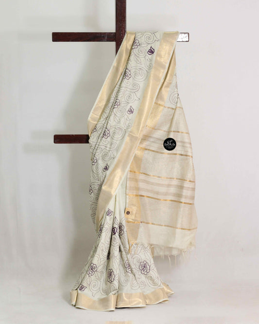 Cream And purple Chanderi Silk Saree with Floral Machine Embroidery
