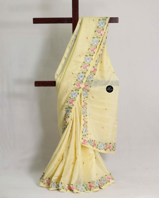 Pastel Yellow Silky Kota Saree with Floral Machine Embroidery & Lace Piping