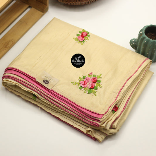 beige raw silk saree with cast on floral hand embroidery and bead embellishments scattered across saree