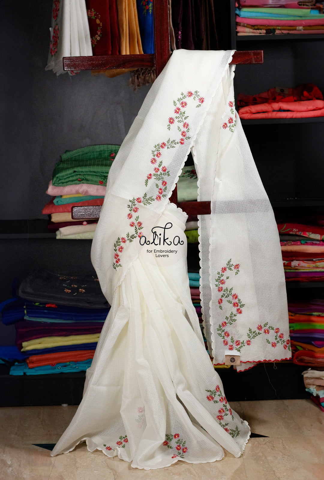 Radiant Beauty: White Striped Kota Saree with Red, Green, and Yellow Machine Embroidery