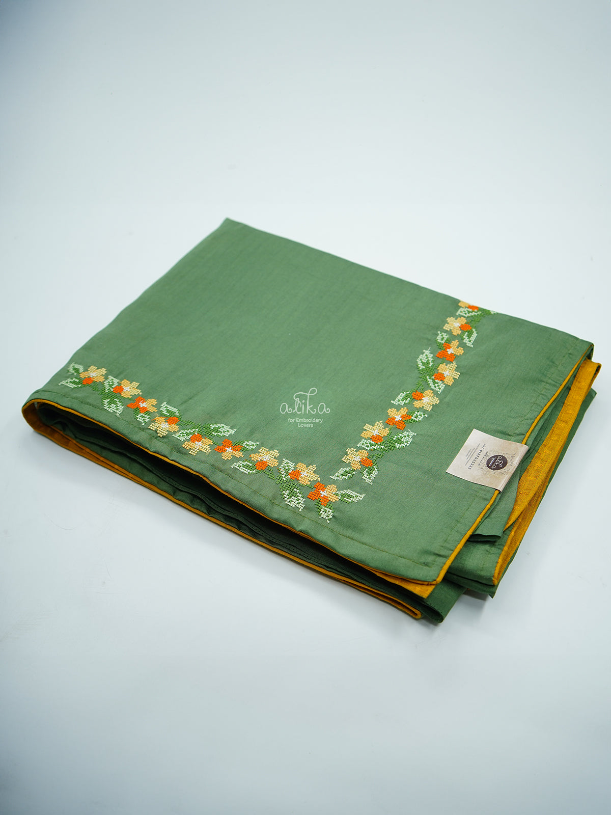 GREEN SEMI SILK SAREE WITH CROSS STITCH AND PIPING