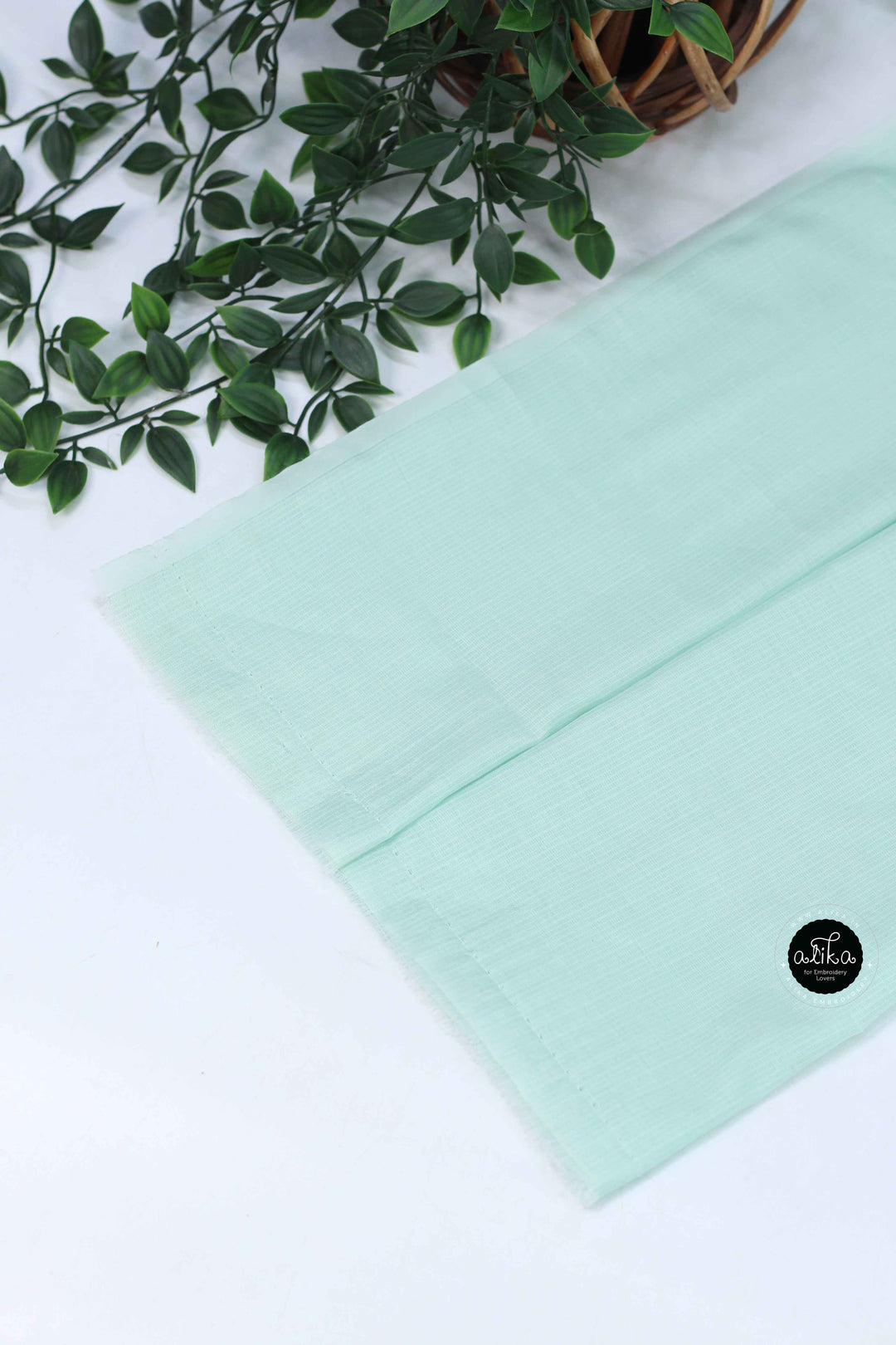 Mint Green Silky Kota Saree with Floral Machine Embroidery