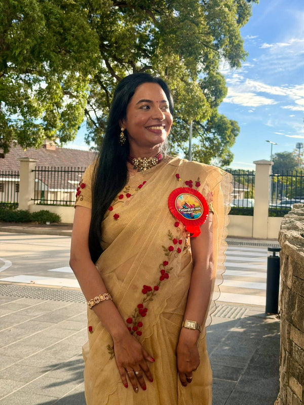 Customer wearing Pure golden tissue Saree with floral hand embroidery
