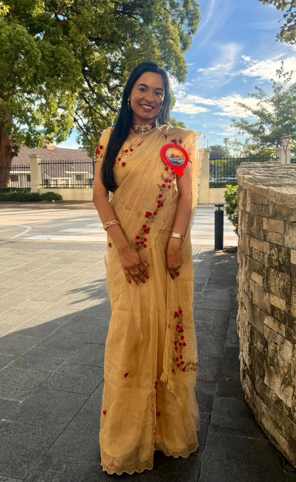 Customer wearing Pure golden tissue Saree with floral hand embroidery