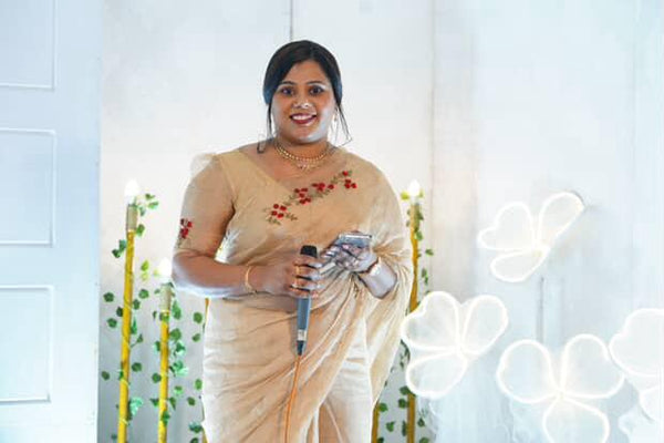 Customer wearing Pure golden tissue Saree with floral hand embroidery