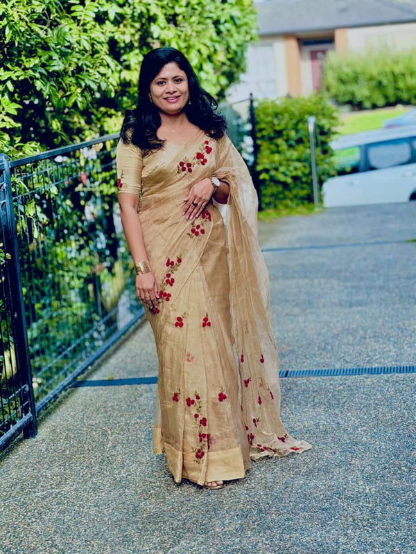 Customer wearing Pure golden tissue Saree with floral hand embroidery