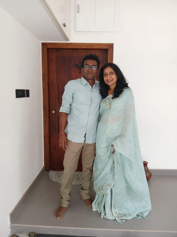Customer wearing Bright Sea Green Pure Linen Saree with Floral Hand Embroidery