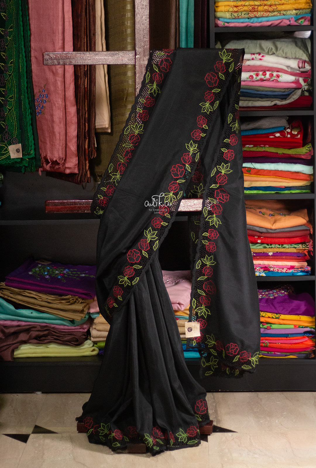 BLACK  SEMI  SILK  SAREE WITH FULL BORDER CUTWORK AND FLORAL EMBROIDERY