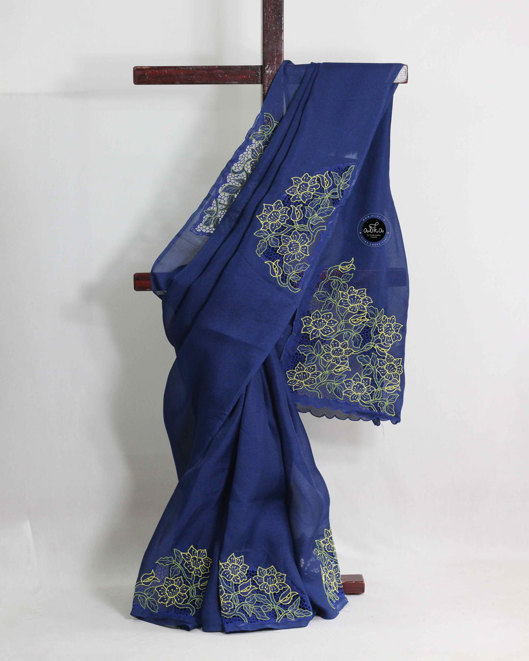 BLUE JUTE NET SAREE WITH TWINE CUTWORK AND FLORAL MACHINE EMBROIDERY
