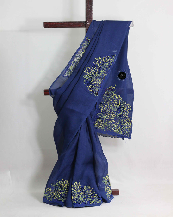 BLUE JUTE NET SAREE WITH TWINE CUTWORK AND FLORAL MACHINE EMBROIDERY