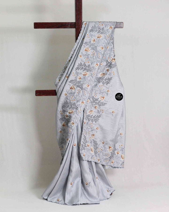 Light Gray Semi Silk Saree with Floral Machine Embroidery and Cutwork Border