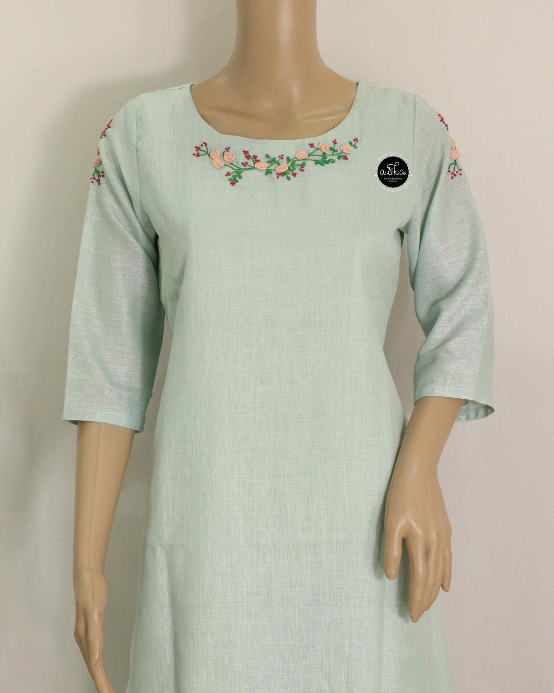 Mint green Semi-Linen Stitched Kurti with Floral Hand Embroidery on Neckline &amp;