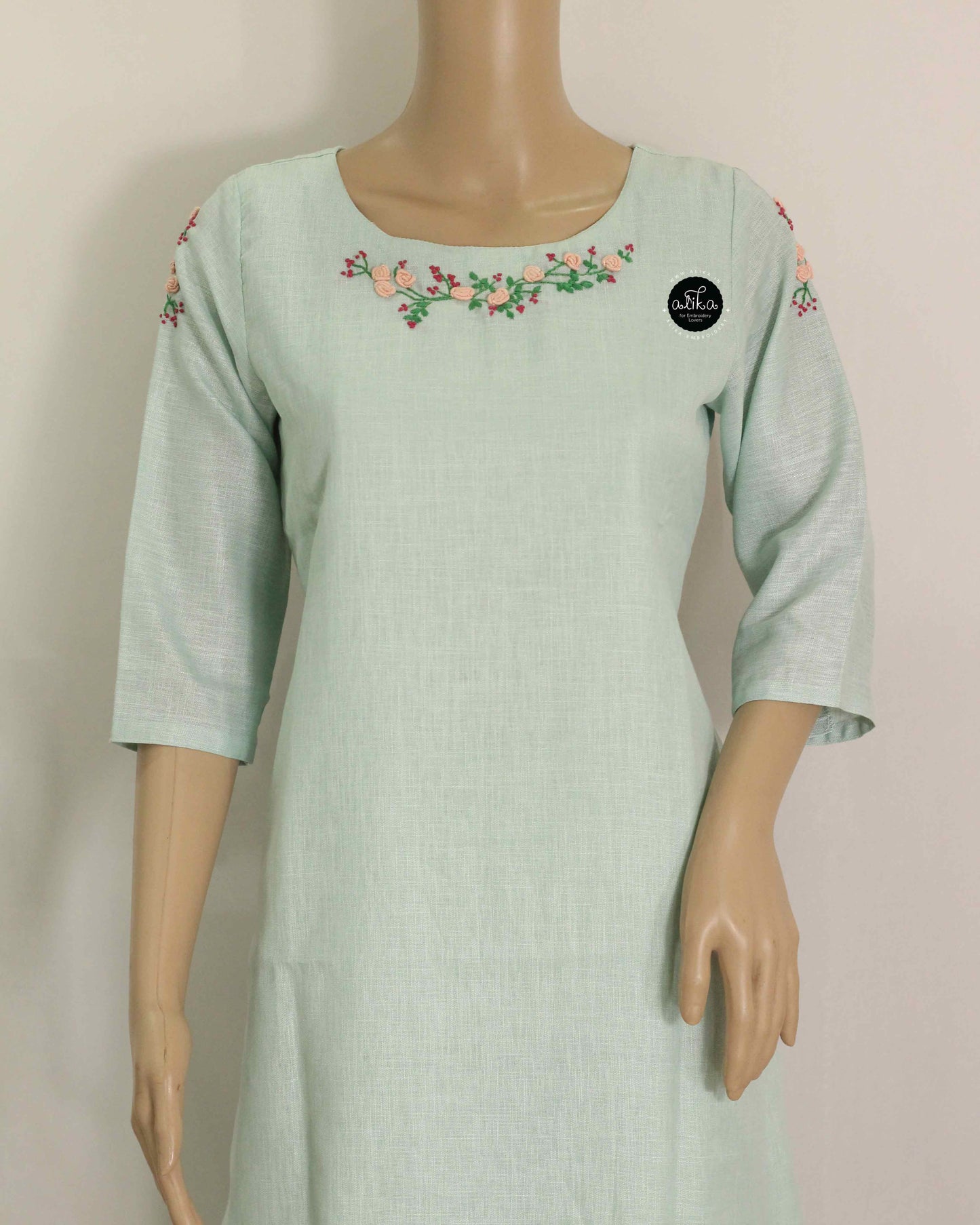 Mint green Semi-Linen Stitched Kurti with Floral Hand Embroidery on Neckline & Top of the Sleeves