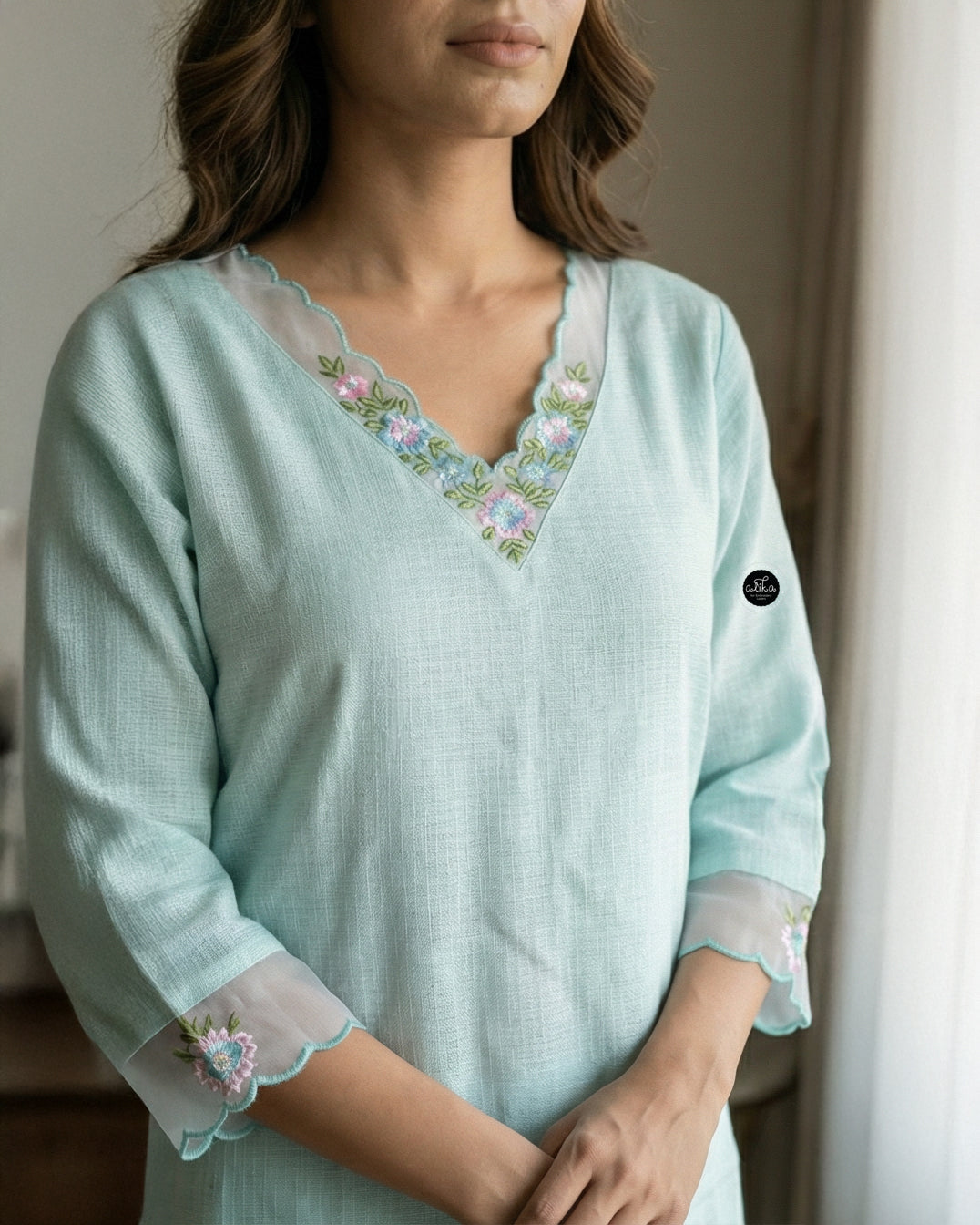 Pastel Blue Stitched kota Kurti with Floral Embroidery on Neckline & Sleeves