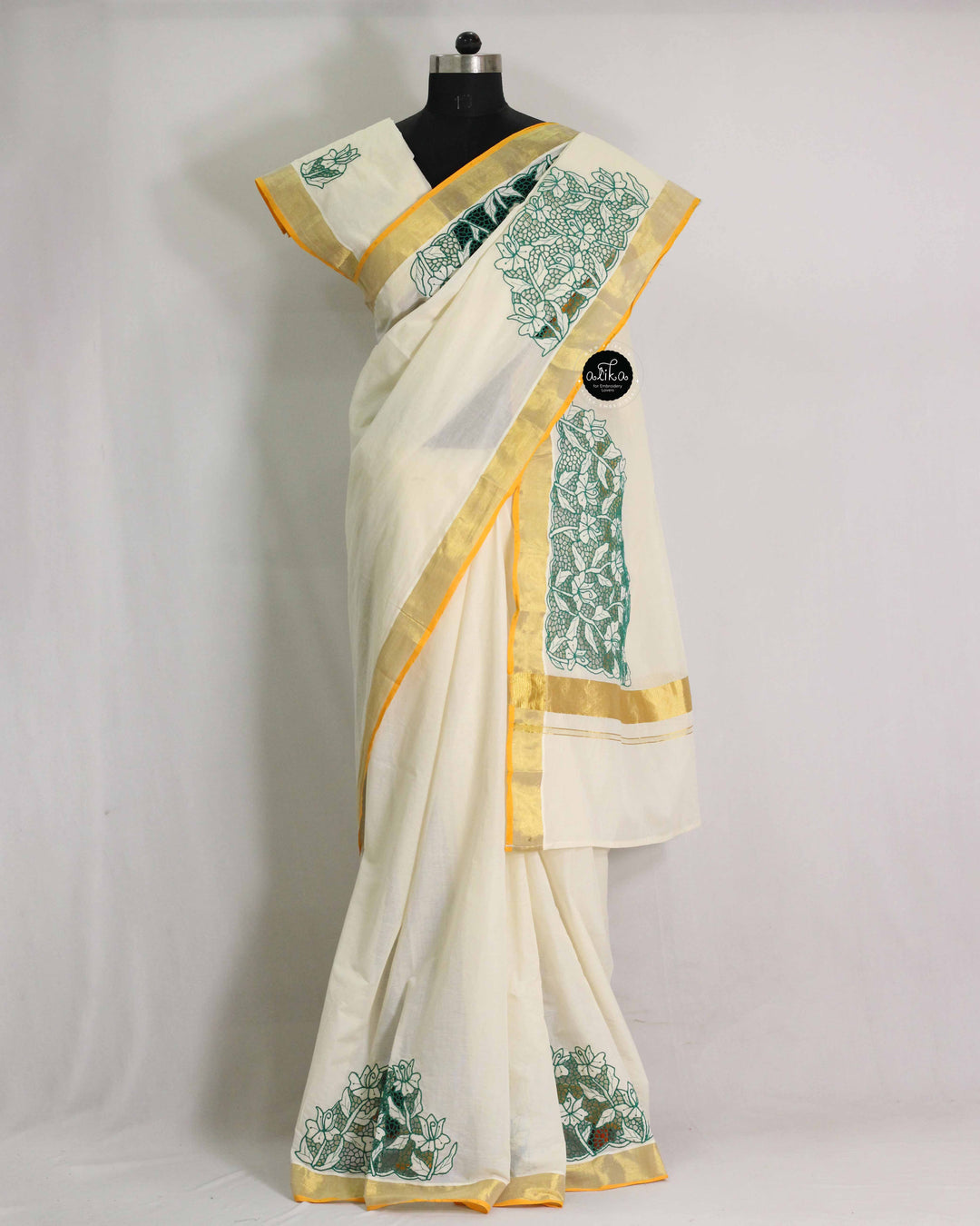 Cream Kerala Saree with Green Floral Twine Cutwork