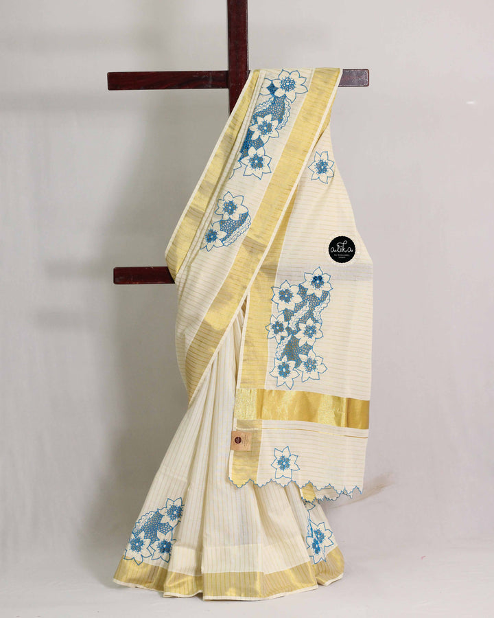 Cream Kerala Saree with Golden Stripes &amp; Blue Cutwork