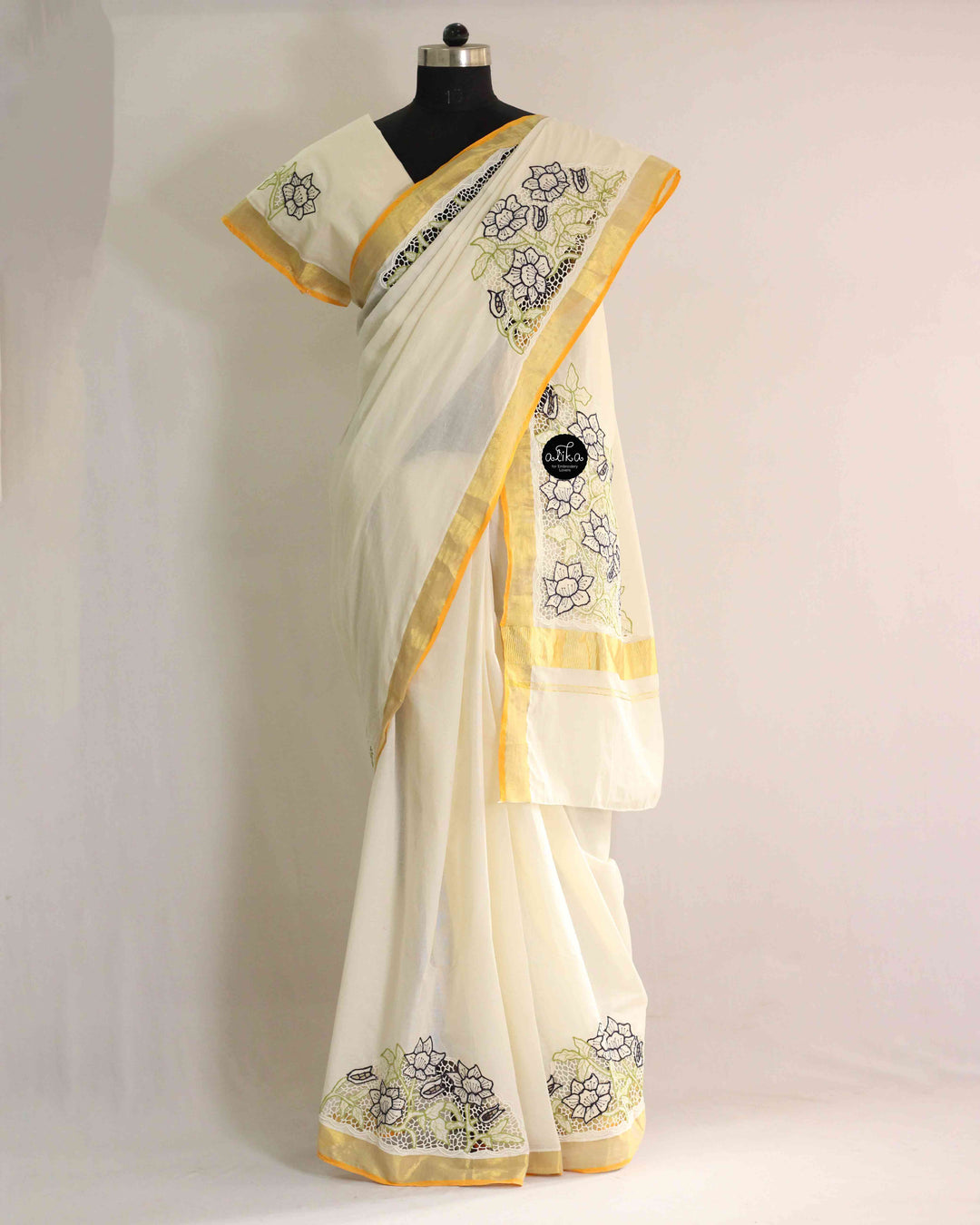 Cream Kerala Kasavu Saree with Floral Twine Cutwork