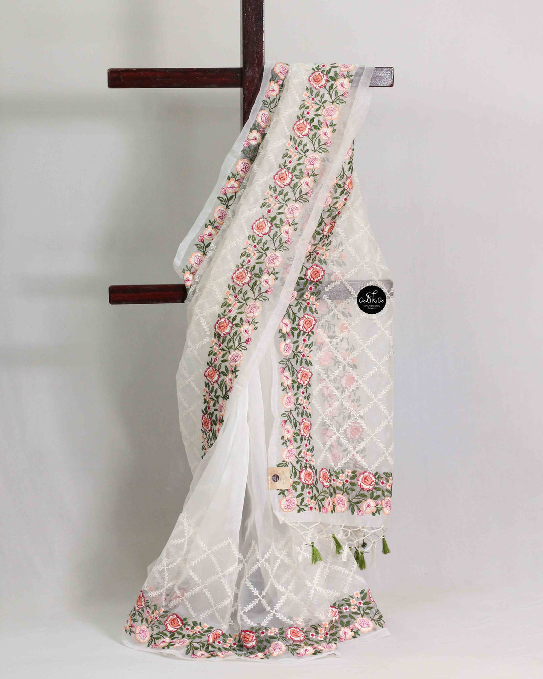 White Organza Saree with Floral Machine Embroidery and Tassels