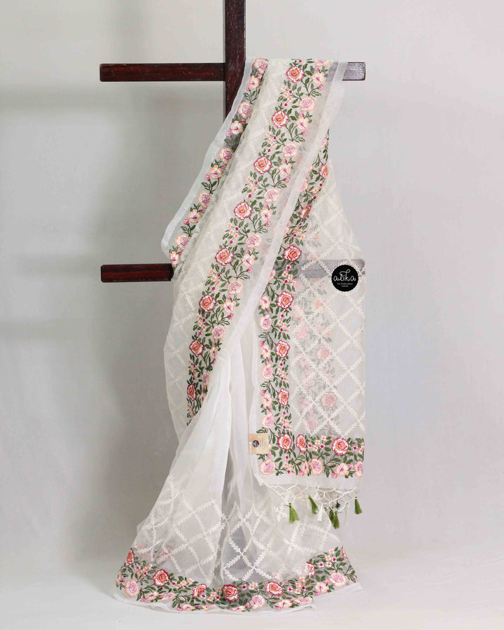 White Organza Saree with Floral Machine Embroidery and Tassels
