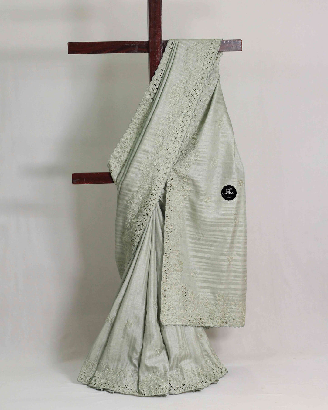 Light Sage Green Semi Silk Saree with Floral Machine Embroidery and Cutwork Border