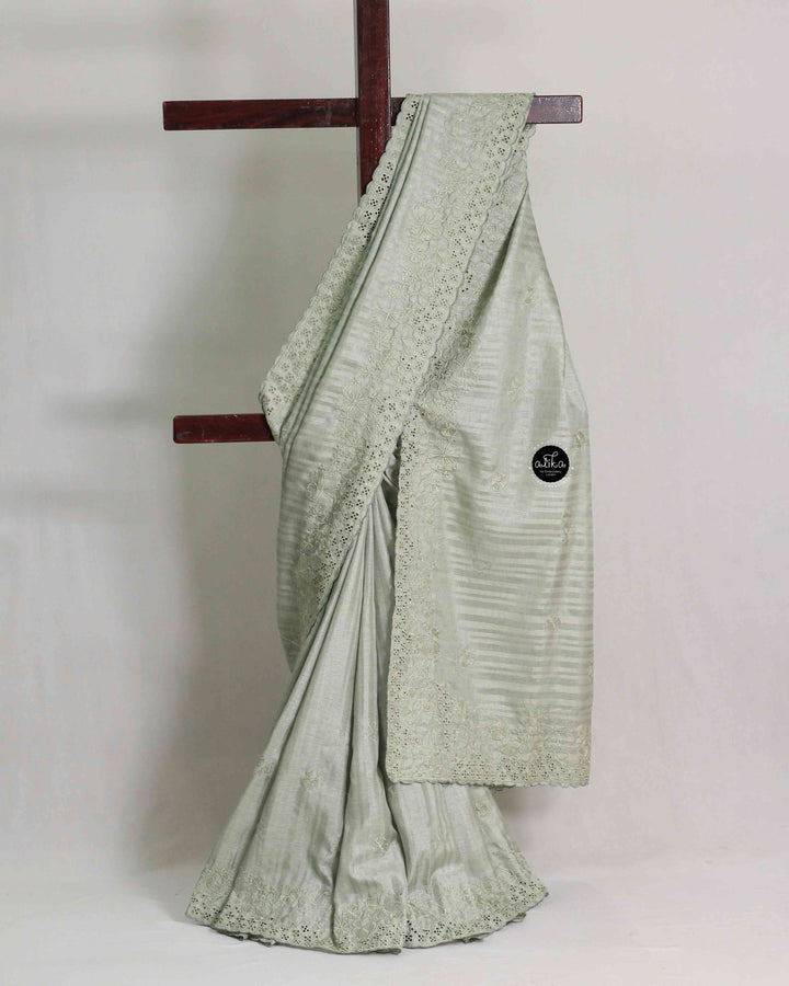 Light Sage Green Semi Silk Saree with Floral Machine Embroidery and Cutwork Border
