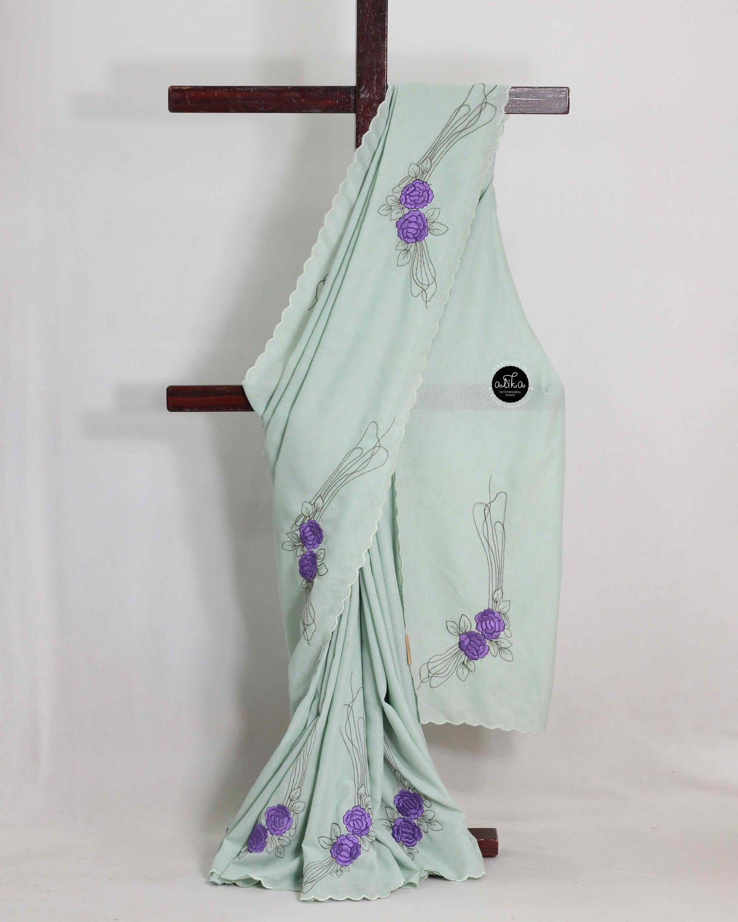 LIGHT GREEN SOFT SILK SAREE WITH VIOLET FLORAL MACHINE EMBROIDERY