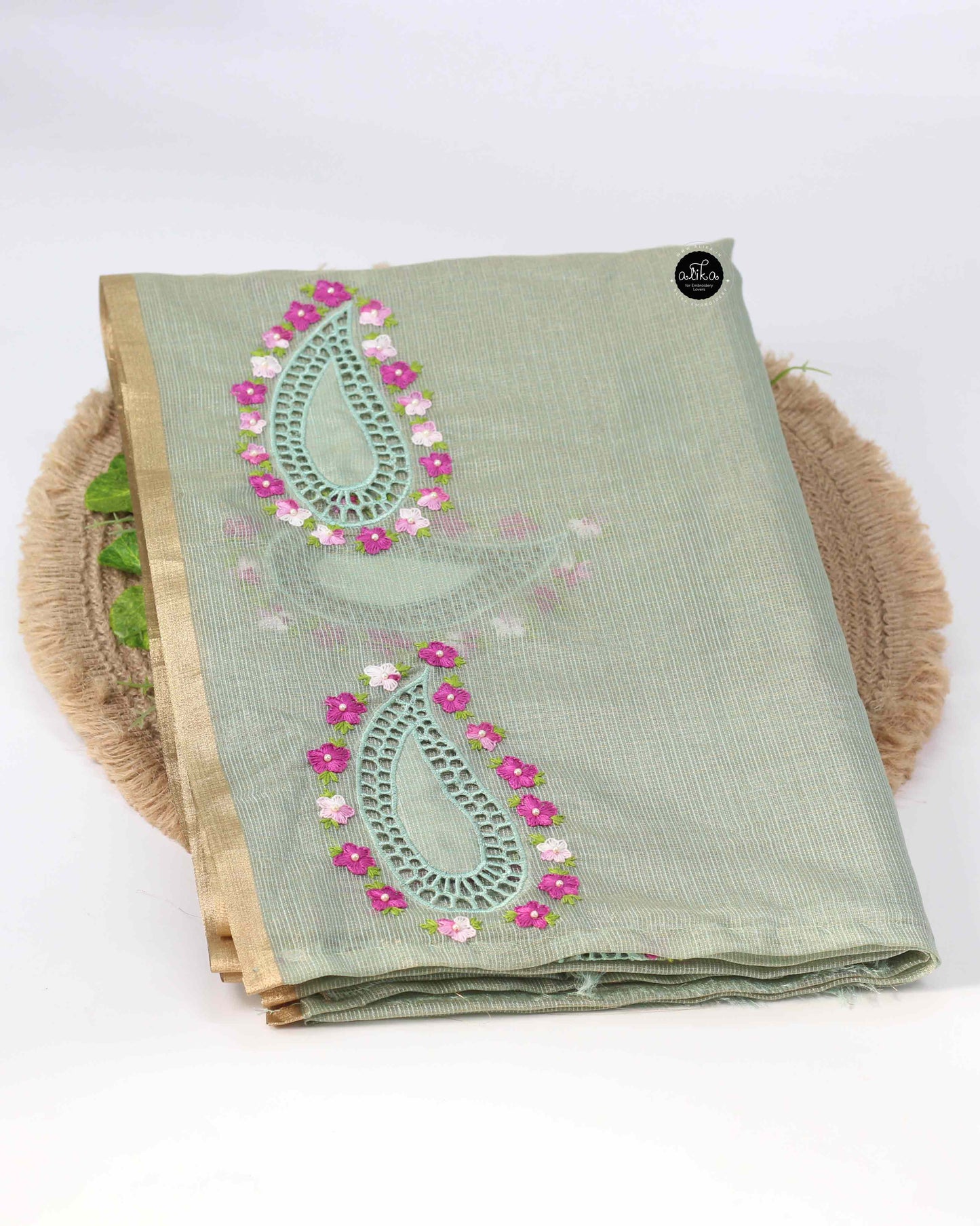 Green semi tissue saree with floral embroidery and cutwork