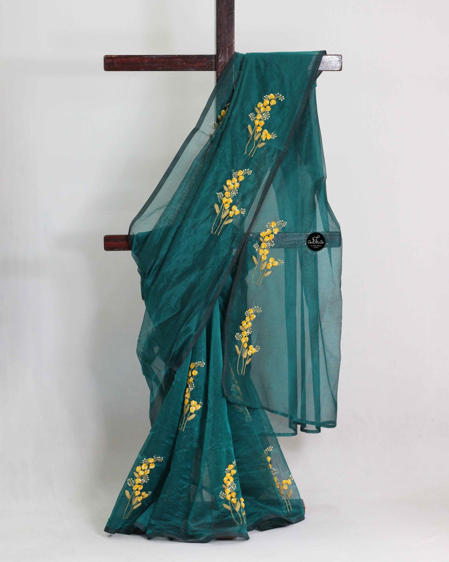 Dark green kota saree with floral hand embroidery