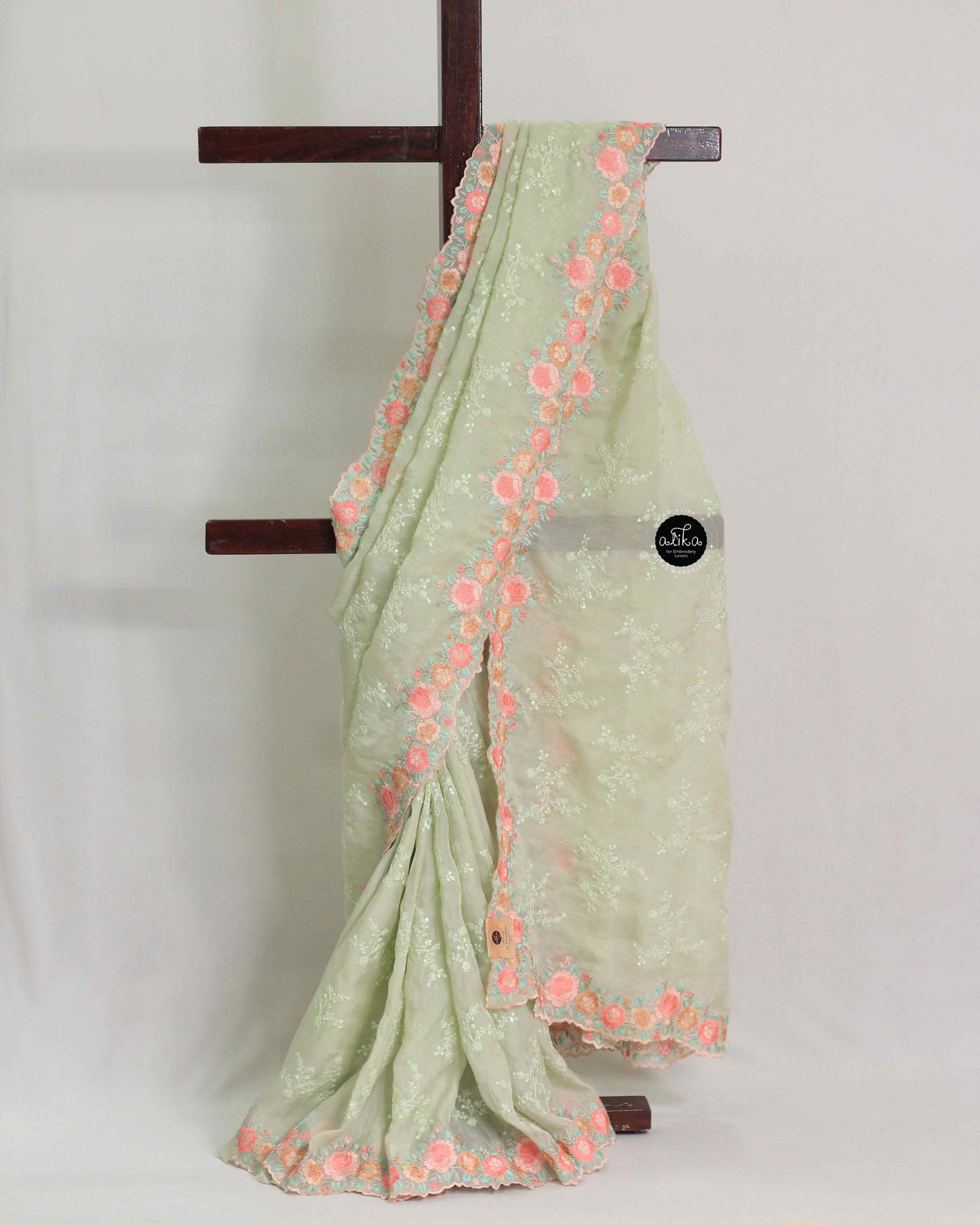 Light Pista Green Organza Saree with Floral Full Border Embroidery and Sequin Work