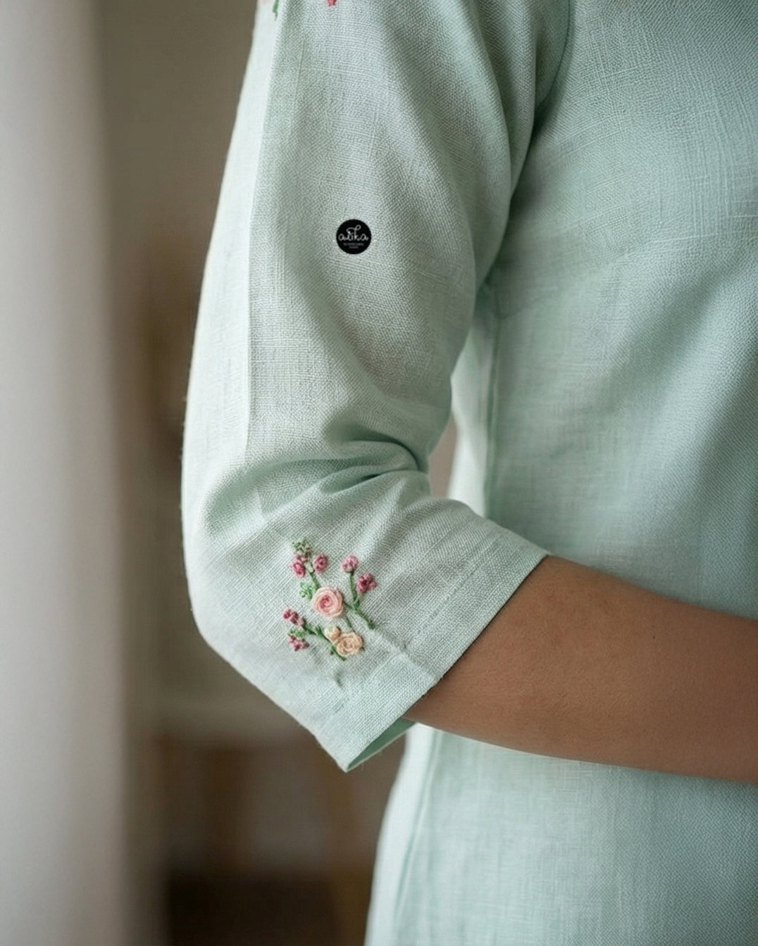 Mint green Semi-Linen Stitched Kurti with Floral Hand Embroidery on Neckline & Top of the Sleeves