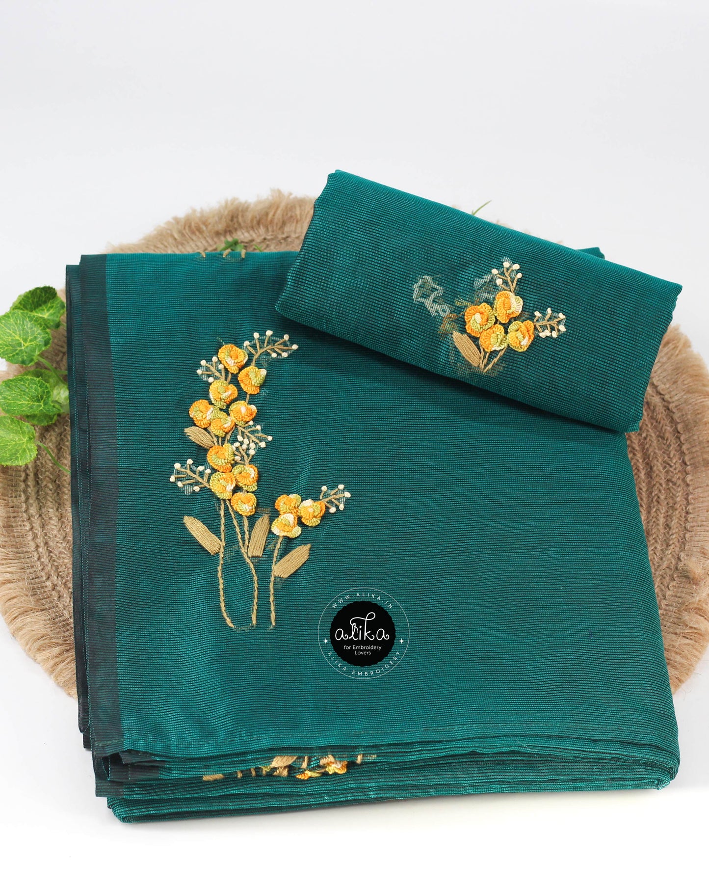 Dark green kota saree with floral hand embroidery