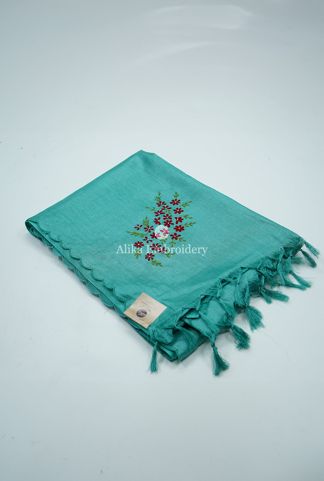 Vibrant Charm: Green Tussar Silk Saree with Red Floral Machine Embroidery and Beads