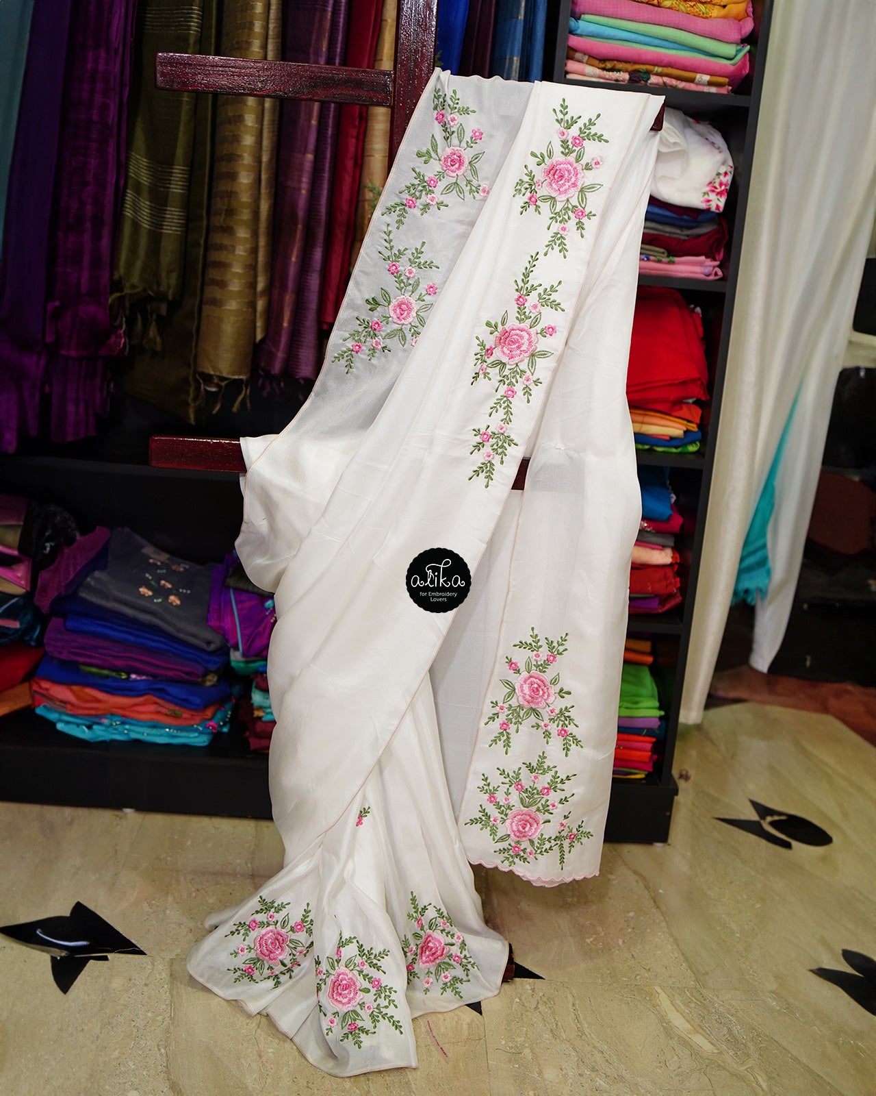 WHITE CRISPY GEORGETTE  SAREE WITH PINK FLORAL MACHINE EMBROIDERY