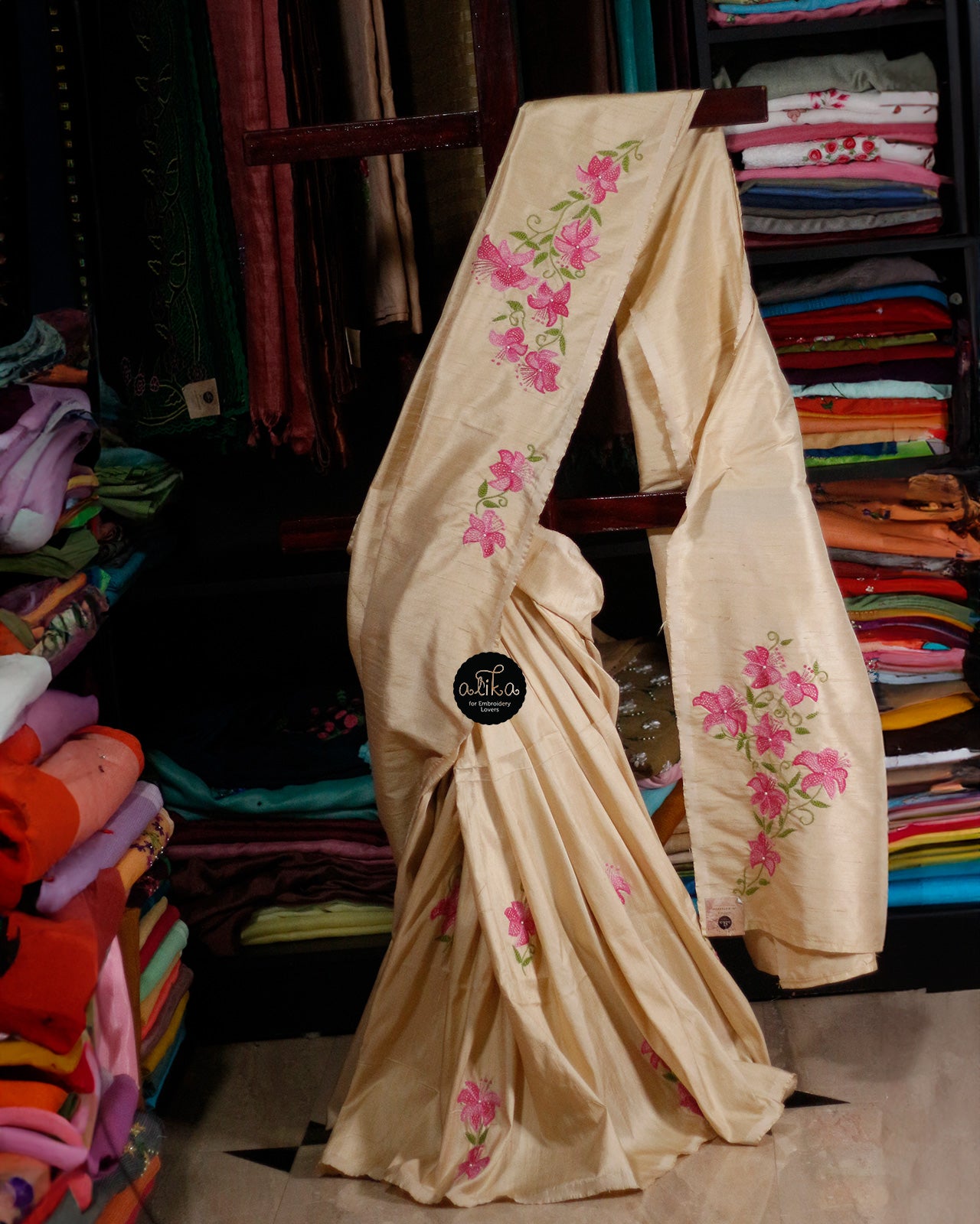 LIGHT GOLD RAW SILK SAREE WITH PINK AND GREEN HAND EMBROIDERY