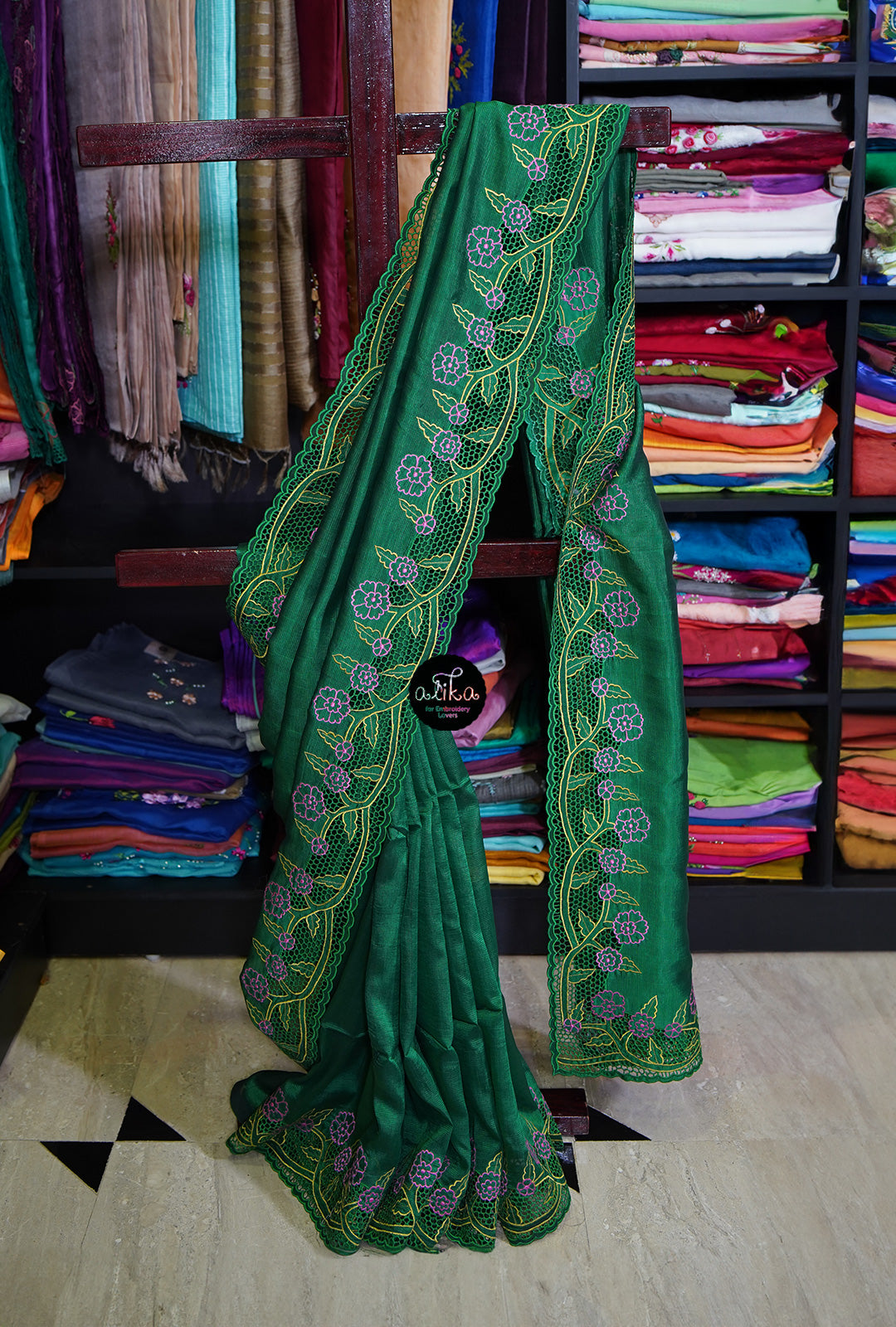 Dark green mangalgari silk with floral sprig pattern cutwork across the borders