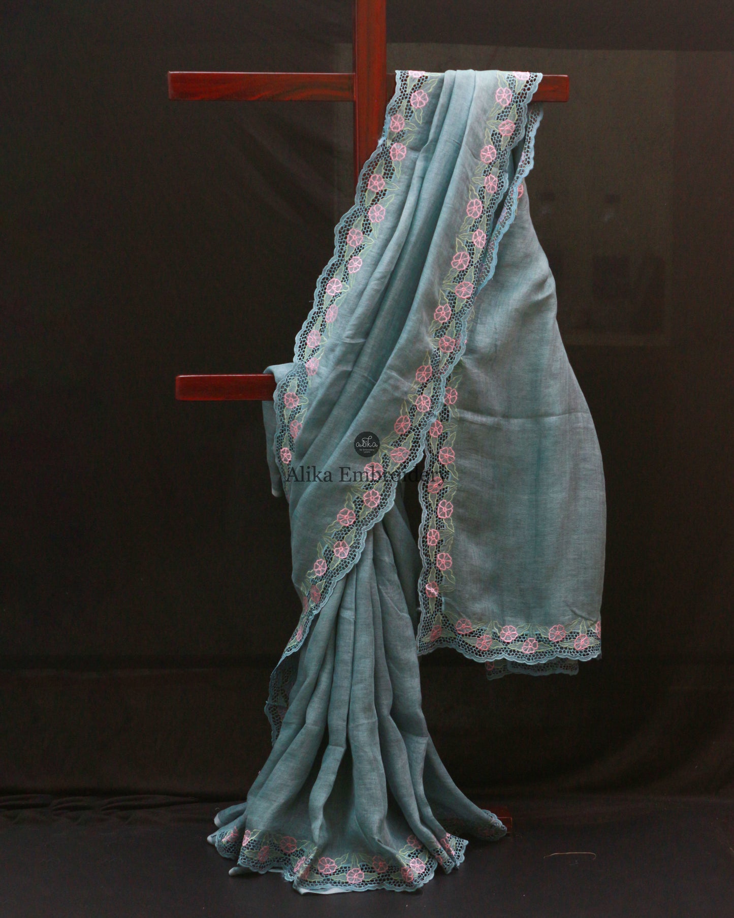 pastel sky blue LINEN SAREE WITH FULL BORDER CUTWORK AND FLORAL MACHINE EMBROIDERY