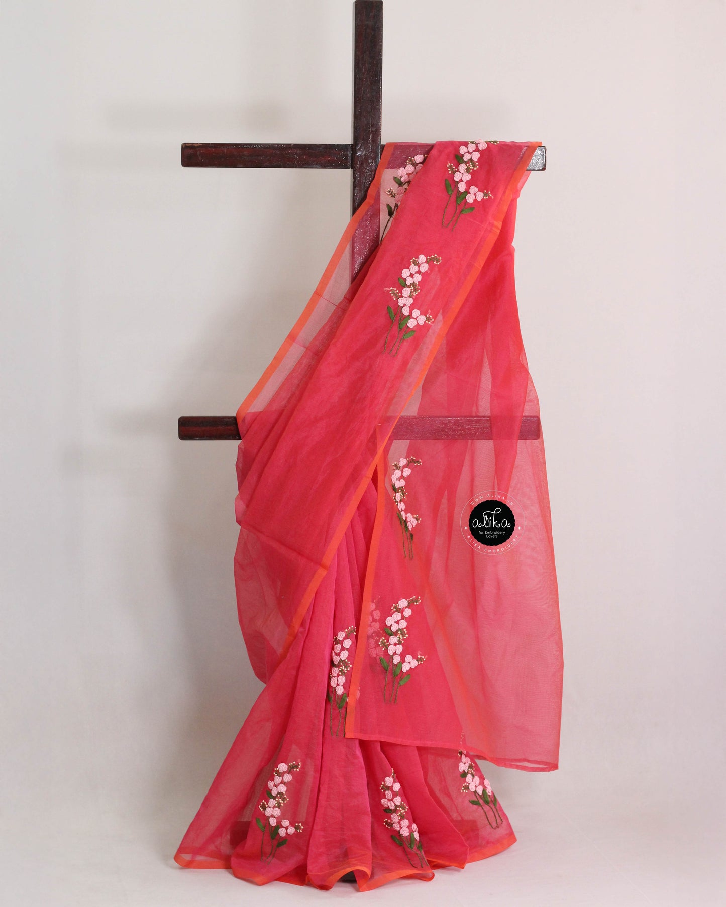 Warm pink kota saree with floral hand embroidery