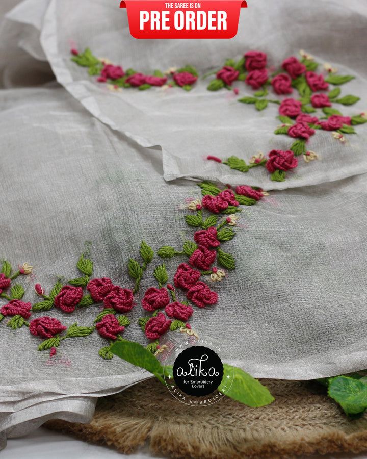 Shimmering Silver Tissue Silk Saree: A Masterpiece of Hand Embroidery