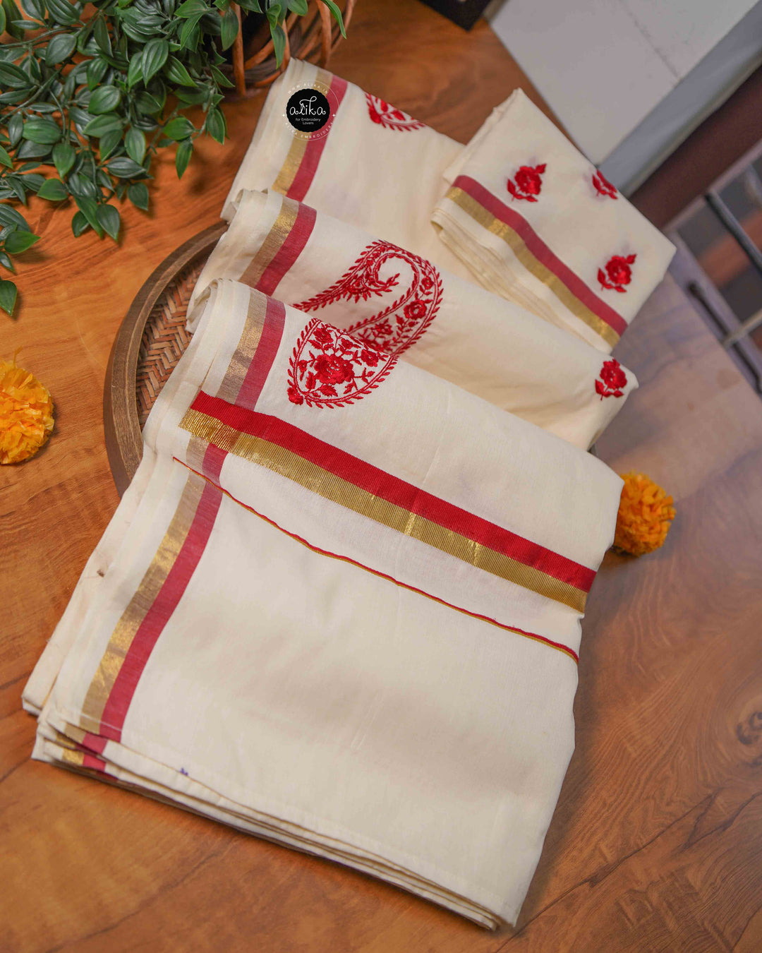 Cream Kerala Saree with Floral Machine Embroidery and Red &amp; Gold Border