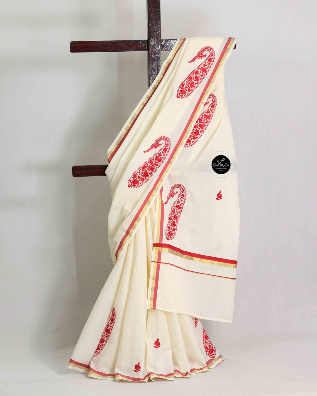 Cream Kerala Saree with Floral Machine Embroidery and Red &amp; Gold Border