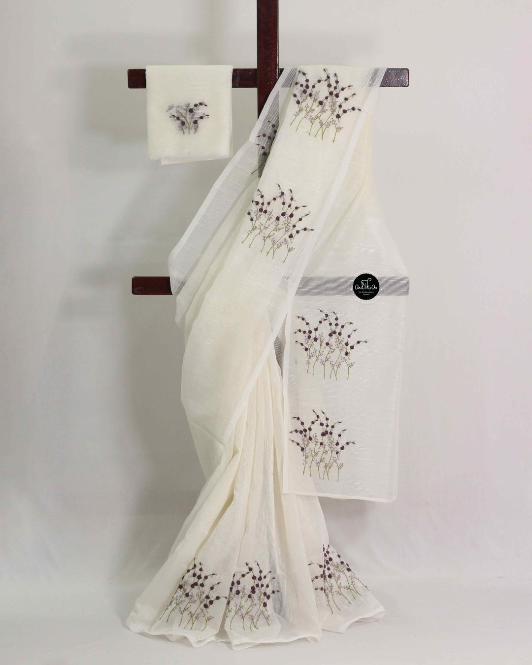 Off-white Kota saree with floral hand embroidery