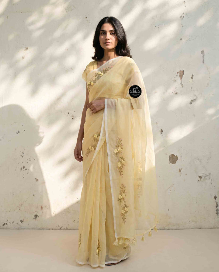 Light Yellow Kota Saree with Floral Hand Embroidery and tassels